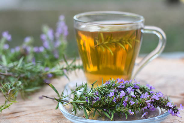 istock Cup of  fresh natural tea on wooden table 1016189532