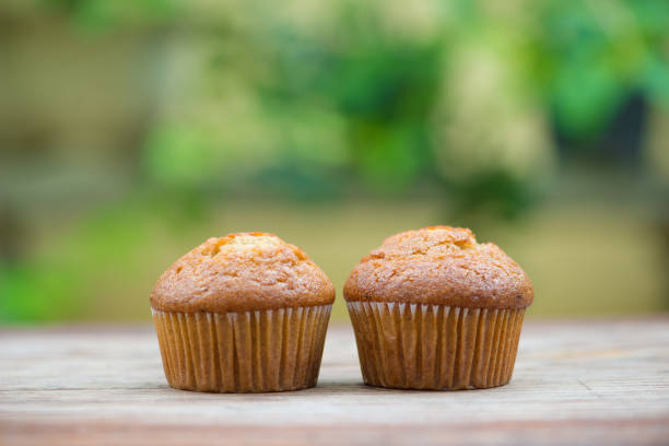 istock Banana cup cake on wood floor 1016192628