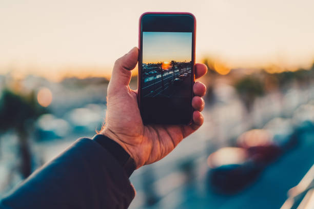 istock Tourist photographing the sunset 1016210022