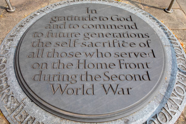 Coventry, UK - July 26th 2018: A plaque inside the ruins of the old Coventry Cathedral commemorating the self-sacrifice of those who served on the Home Front during the Second World War.