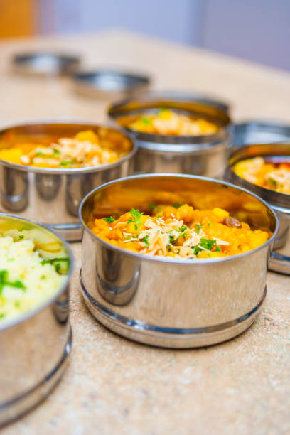 sweet potato and cauliflower curry in indian tiffin (dabba) lunch boxes - lunch box lunch box metal imagens e fotografias de stock