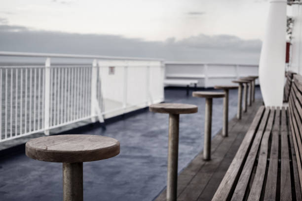istock Bench and tables on the deck of a ferry 1016227040