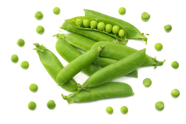 istock fresh green peas isolated on white background. top view 1016237484