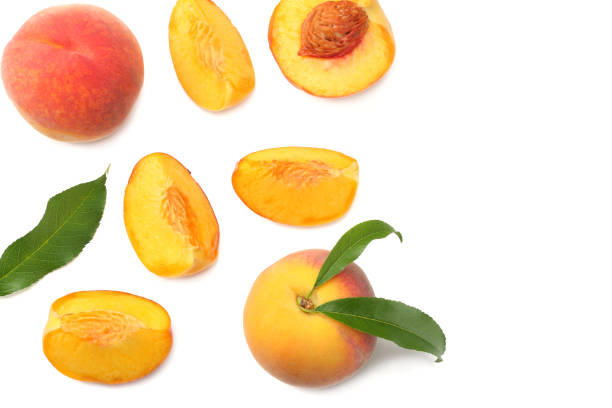 istock peach fruit with green leaf and slices isolated on white background. top view 1016237662
