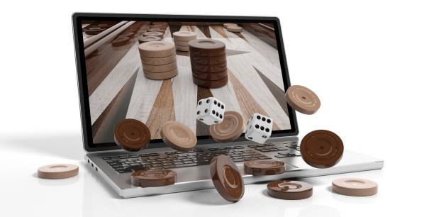 hölzerne backgammon aus einem laptop. 3d illustration - gambling chip gambling internet isolated stock-fotos und bilder