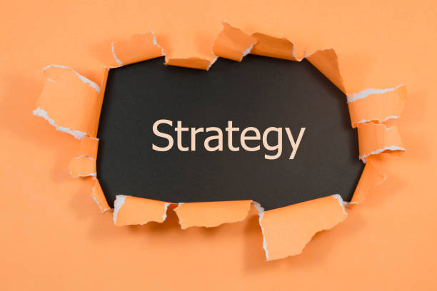 istock The word strategy appearing behind torn paper. 1016256018