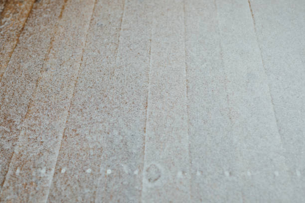 istock snow patina on wooden lags background 1016256108