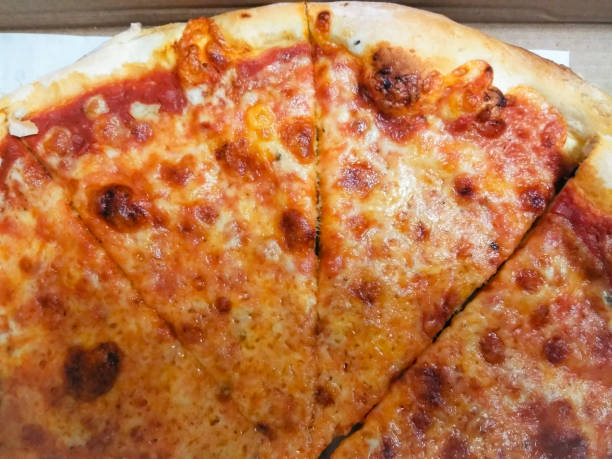 istock Italian Cheese Pizza Slices Closeup 1016266194