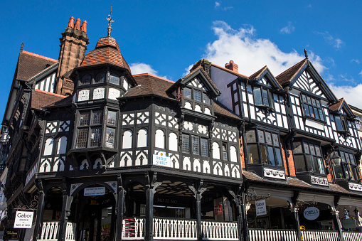 Chester, UK - August 2nd 2018: The beautiful architecture of The Rows on Bridge Street in the historic city of Chester in Cheshire, UK.