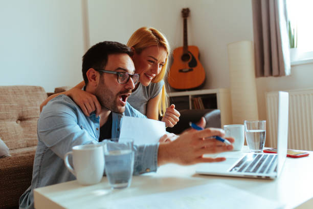 istock Happy couple relaxed at home 1016272630