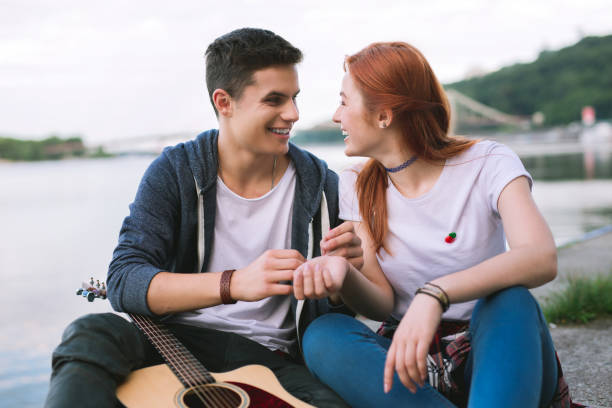 Pleasant cheerful people looking at each other