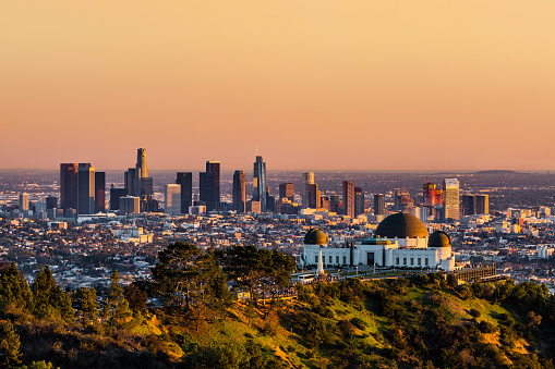 Los Angeles skyscrapers and Griffith Observatory at sunset