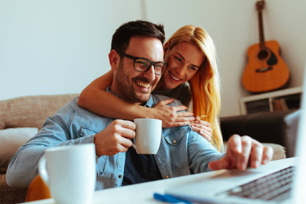 istock Happy couple relaxed at home 1016275650