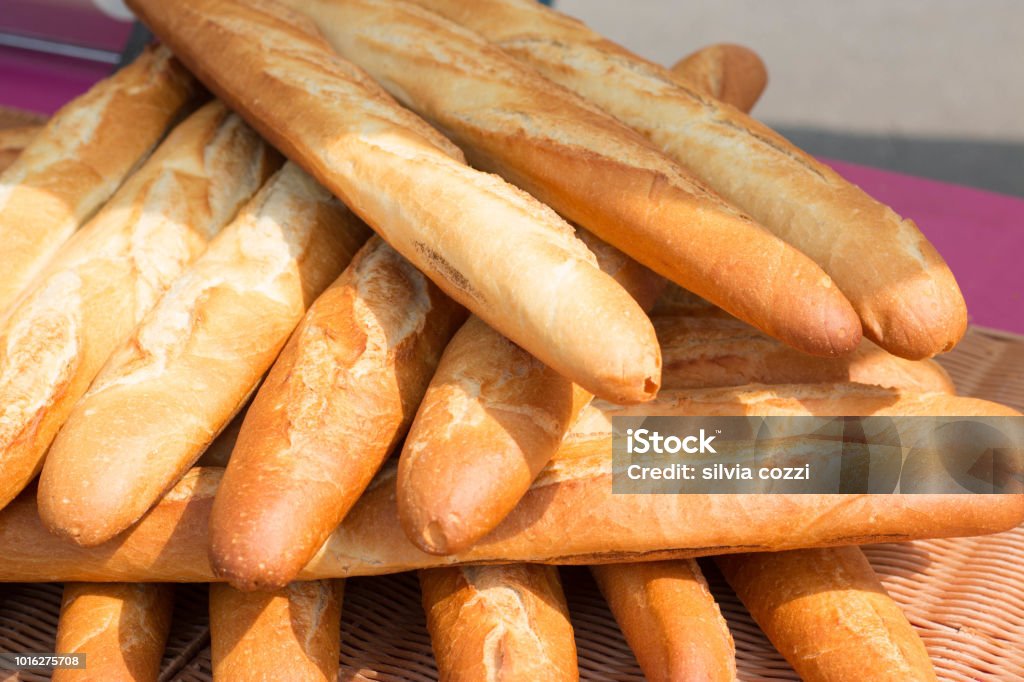Baguettes The Famous Long And Thin French Bread Close Up Of A Pile