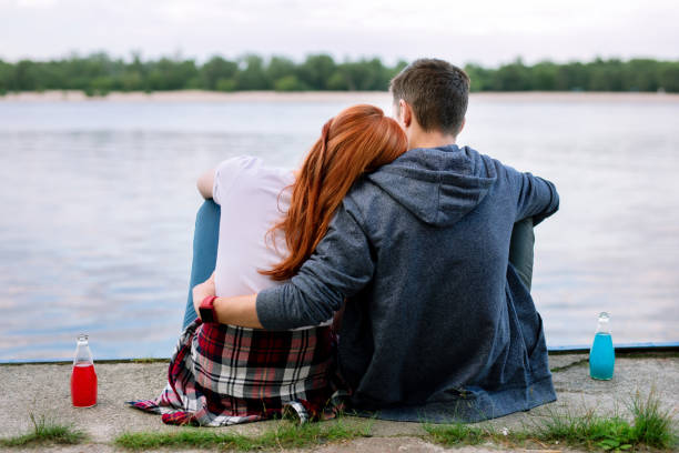 istock Nice peaceful couple looking at the river 1016276014