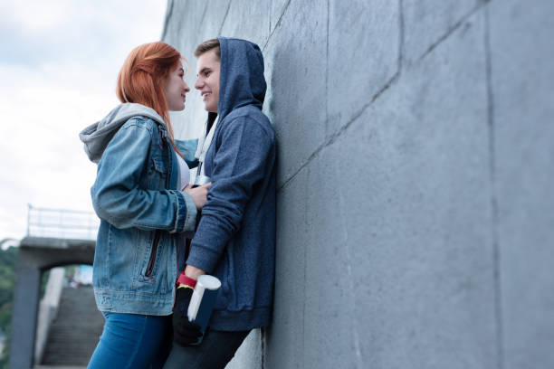 istock Nice young couple standing together Romantic date 1016284002