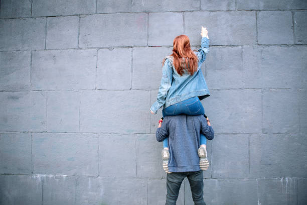 istock Nice strong man holding his girlfriend Romantic date 1016287038