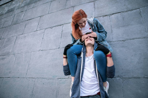 istock Nice positive woman closing her boyfriends eyes 1016287270