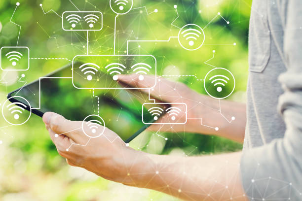 istock WiFi  concept with man holding his tablet 1016314574
