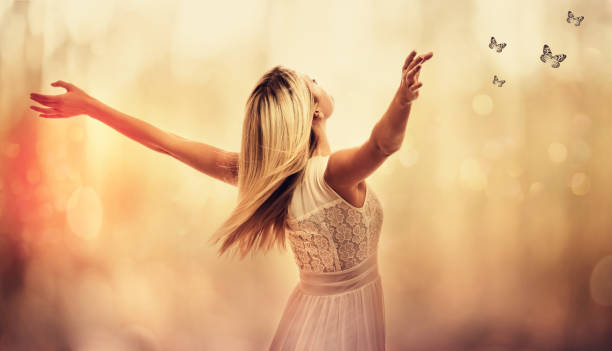 istock Beautiful woman standing with arms open 1016314610