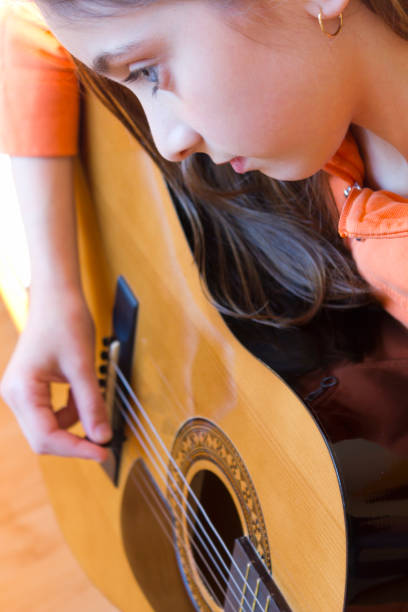 istock Girl playing guitar 1016335300