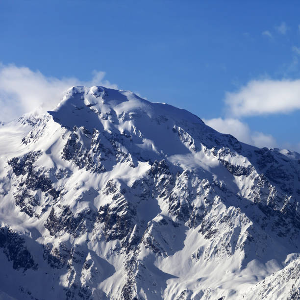 istock Snowy mountains at nice sunny day 1016335834