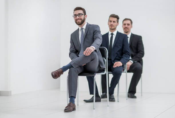 istock group of serious business people waiting for the interview 1016341570