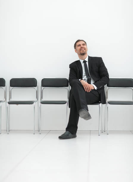 istock thoughtful businessman sitting in the office hallway 1016350858