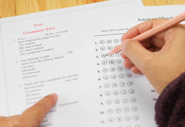 multiple choice test English multiple choice test on table english spoken stock pictures, royalty-free photos & images