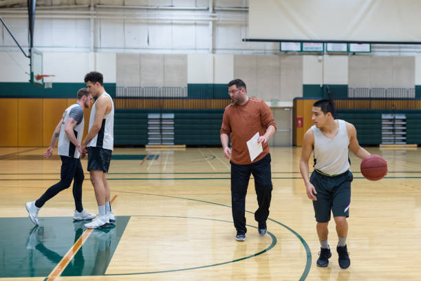 istock College coach running men's basketball practice 1016372272