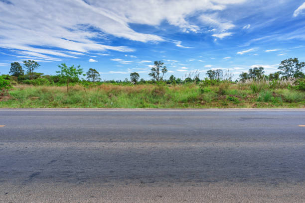 istock Asphalt road side view and landscape countryside. 1016372568
