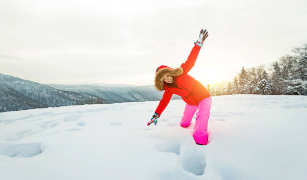 istock Woman walking through the deep snow 1016390060