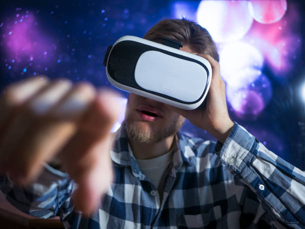 istock buisness man using virtual reality glasses, close up hand gestures with neon lights, concept 1016401154