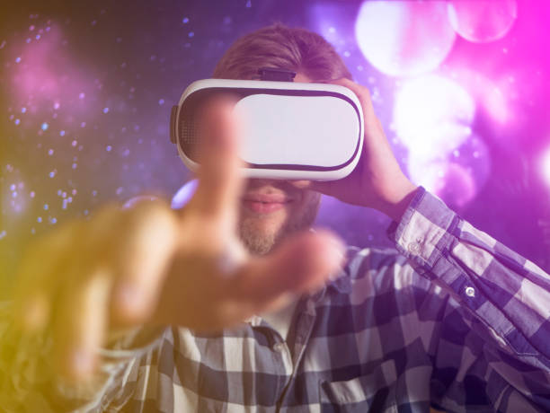 istock buisness man using virtual reality glasses, close up hand gestures with neon lights, concept 1016401178