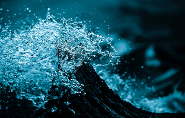 amazing wave in motion blue water background, splashing wave with speed. fast water stock pictures, royalty-free photos & images