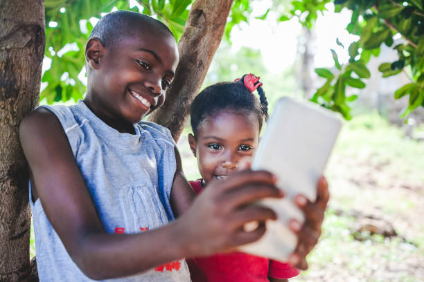 istock young african kids on mobile phone 1016454380