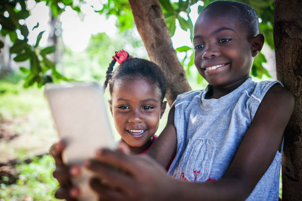 istock young african kids on mobile phone 1016454526