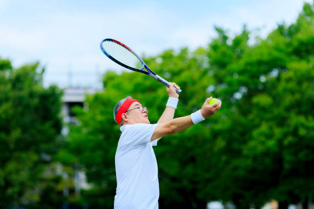 istock Senior men playing tennis 1016462598