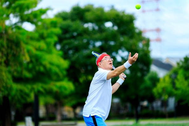 istock Senior men playing tennis 1016462632