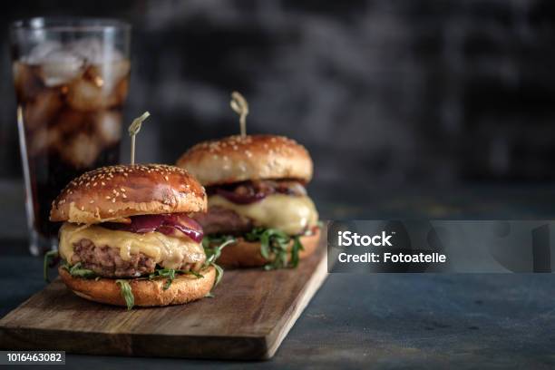 Homemade Tasty Hamburger With Beef Cheese And Caramelized Onions Street Food Fast Food Copyspace Stock Photo - Download Image Now