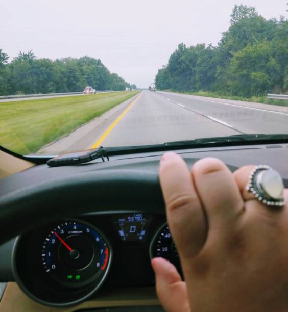 Hand on Steering Wheel - Driving Travel Road Trip
