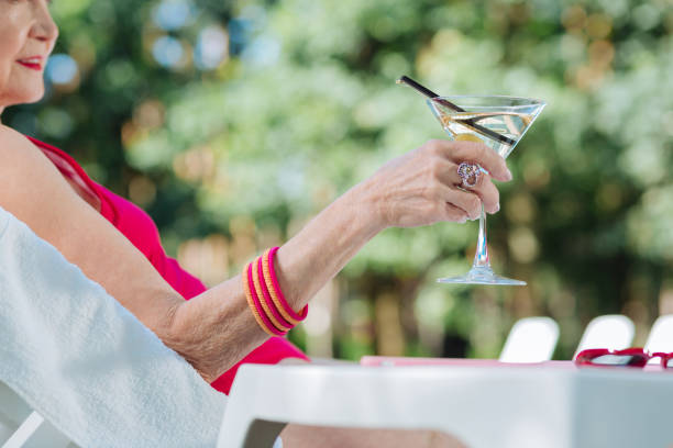 istock Mature woman relaxing while having cold refreshing cocktail 1016468592