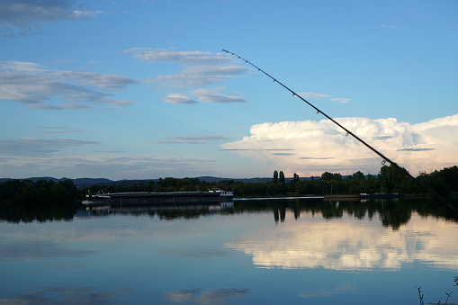 Fishing in Germany on a warm summer evening on the Danube