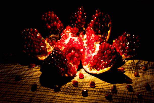 istock Pomegranate with slices and green leaves 1016481868