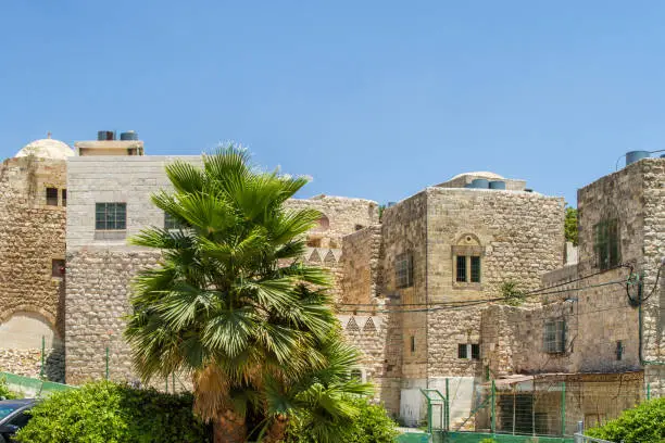 Ancient Middle Eastern architecture, old stone houses with narrow windows and with flat and domed roofs near the Cave of the Patriarchs in old city of Hebron, Israel