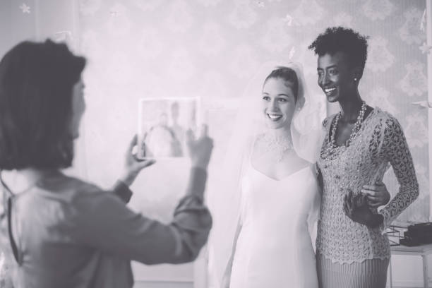 The bride is trying out her wedding dress accompanied by her friends