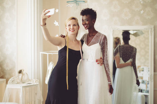 istock Fashion designer is taking a selfie with her happy client 1016485626