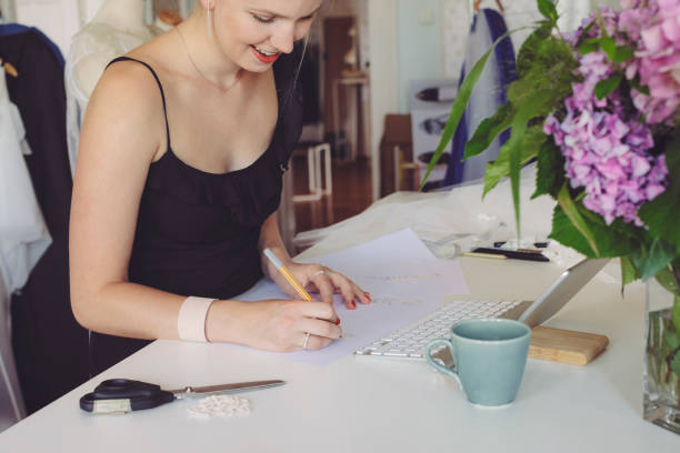 istock Fashion designer is drawing sketches 1016485674