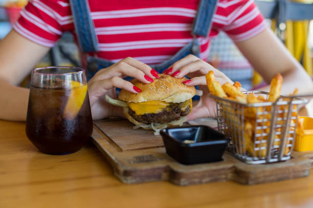 istock Woman holding meat burger 1016491456
