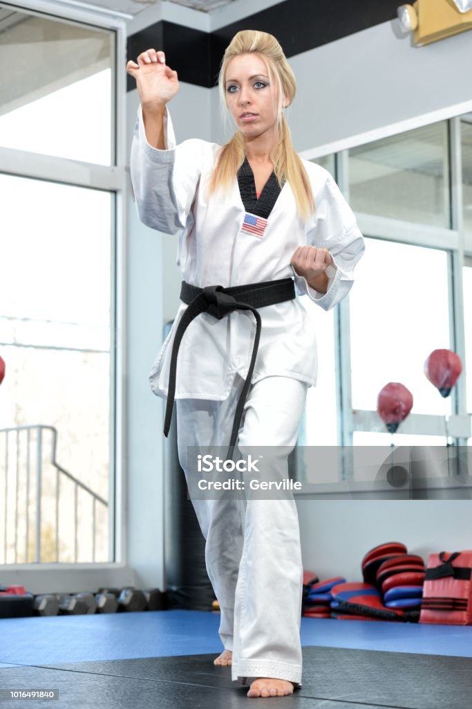 Martial Art School Training Martial artist training in her gym. Adult Stock Photo